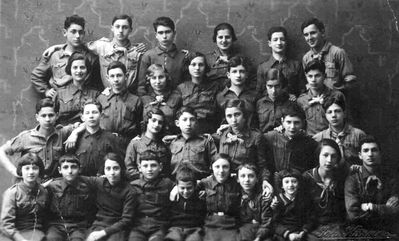 1933-4-25 - Narva Hashomer with "madrichim"
Top row: Zemach Schapiro, Isi Goldmann, Jossi Mesnikov, Aharon Zechovoi, Lika Schampal, Mischa Zimbalov, Monja Schmotkin
II row: Lena Rutstein, Sika Baran, Sonja Maslovski, Bluma Geruchmanov (Stein), Rolka Zimbalov, Hiti Girman, Isi (Isak) Haitin,
III row: ?, Abram Kulman, Rimma Zimbalov, Aron Maslovski, Bluma Schapiro, ?, Dov Maisel
Bottom row: Lena Rosenberg, Faiva Schapiro, Selda Harhat, Dora Zagorje, Leva Zagorje, Ditta Rosenberg, Dina Danzig, Alter Zimbalov
