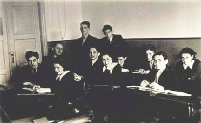 Tallinn - 1938. Jewish Gymnasium - 1938? (1941 graduation)
Left to right :

Sitting: Pessah (Petja) Freidin, Lifschits (math. teacher from Poland), Rachel Naimark, Hirsch Gleser, Lia Freidin (Rubanovitsch), ?, ?, Aharon Rybka, ? 
Standing: Isi Migdal, Jakob Vald (came from Germany)
