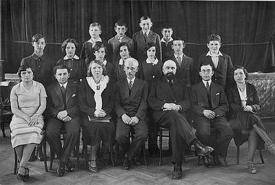 Tallinn - 1932. Jewish school -  1932 - VI class
First class to study in Hebrew - end of the elementary school in 1932.
Left to right.
Top row: Ben-Ami Lerenmann, Jossi Mesnikov, Bubi Lipavsky, Jacov Aronovitsch
Middle row: Philip (Fili) Brin, Resi Goldmann (Wasserman), Sara Schats, Njusa Passov, Riva Nesher (Itzoch), Zeev (Vulja) Schats, Ami Markovitsch
Sitting: Passov (Hebrew teacher), Kosotsky (Hebrew), Estonian teacher, the Director Samuel Gurin, Hazan Gurevitsch, Zitomirski, Agi Kellert (gymnastics teacher) 
Keywords: [A] [L] [M] [I] [W] [B] [P] [S]