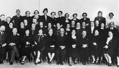 Tallinn - 1935.  Jewish gymnasium Parents committee  ~1935/6
Left to right.
Top row: ?, Pensa - the teacher of Estonian, Zitomirski - Hebrew teacher, ?, Vald?, Slutski, ?, ?, ?, ?, ?, Schulklepper, Rybka
Middle row (all): ?, ?, ?, ?, Isaak Bachmat, ?, Batja Schneeberg, ?, ?, ?, Grinstan, Daile Wasserman, Hoff (Vilenski, maiden ?), Dubovski
 Bottom row: Kantor Gurevitsch, Dr Fridland, Berta Goldmann, Press, Johansson - handicraft teacher, Samuil Gurin - the director, Frieda Berkovitsch, Hirsch (Grigori Aisenstadt) - the Chairman of the Cultural Autonomy, Itskovitsch, ?
