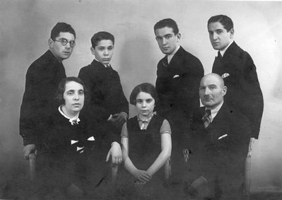 Gordon family in April 1936
Left to right: 
Standing: Jacob, Benjamin, Israel, Gabriel Gordon 
Sitting: Haja Gordon (Kaplan), Liebe Male (Ljuba) Braude (Gordon), Solomon Gordon 
