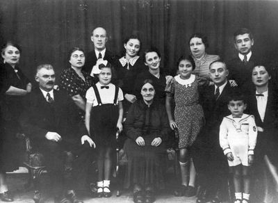 Ivanovski family 1938
Left to right. Sitting: Ore Ivanovski, Daisy Gelb (Grossmann), Beile Ivanovski, Sunda Ivanovski, Abram Leib Ivanovski, Abi Hasin, Batsheva (Keile) Hasin (Ivanovski).
Standing: Anna (Hana) Ivanovski, Jenny (Scheine) Grossmann (Kremer), Moritz Grossmann, Lidia (Pae) Morein (Ivanovski),  Selma Flaks, Freida Ivanovski (Scher), Aron Hasin
Keywords: [G]