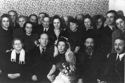 Issai Meilach wedding
Left to right.
Sitting: Sara-Ette Meilach (Katz), Issai Meilach, his wife, Rabbi Aba Gomer, ?
Standing: ?, ?, ?, Irene Falstein (Klas), ?, ?, ?, Zilla Margolin (Meilach), Boris Meilach?, ?, Asriel Meilach, Berta (Bella) Orkin (Meilach), ?, ?, ?, Lea Eidus (Heimann)?
