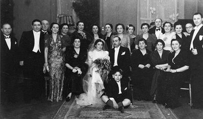 Aronstam wedding - 1937 - in Jewish club at V. Karja 1/9 (III floor)  in Tallinn
Left to right.
Upper row: Leib Hait, Abba Fürst, Samuil Slutski, Mira Matskin, Lena Dymschits (Finberg), Rosa Slutski (Finberg), ?, ?, Bronislava Golomb (Scher, nee Dymschits), Meri Aronstam, Betti Aronstam, Willi Matskin, Dina Slutsk, ?, ?, ?
Sitting: Fenja Hait, Cecilija Aronstam (Hait), Maks Aronstam, Scheine Aronstam, ?, Berta Matskin
The boy: Isak Fürst
