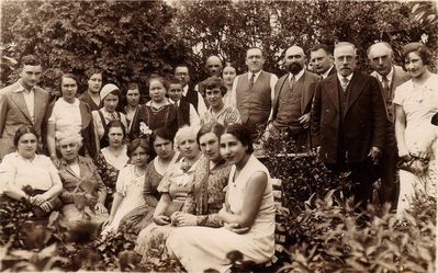 Bar mizva of Teodor Polykovski - 1933
Left to right.
Standing: ?, Anna Klas (Gurevitsch), ?, ?, ?, Varvara Delajev (the nanny), Teodor Polykovsky, Samuil Polykovski, ?, ?, ?, ?, Jossif Gurevitsch, ?, ?, Leib Levitin, ?
Sitting: Sonya Polykovski, ?, ?, ?, ?, Braine Levitin, ?, ? 
