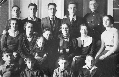 Raichmans and Goldmans ~1933
Left to right:
Top row: Jossi Goldmann, Gutti Raichman, Isi Raichman, Arke (Leo) Raichman, Dodik Raichman
Middle row: Berta Raichman, Rosa Raichman, ? with Harry Raichman), Marjascha Raichman, Fanni Raichman, Haja Raichman
Bottom row: Gera Raichman, Harry Goldmann, Isi Raichman, Leo Goldmann
