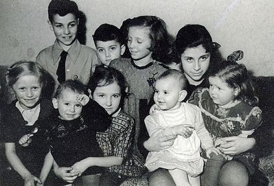 Children ~1949
Left to right.
Standing:  Gabi Hasak, Marek Pakkin, Regina Pessin 
Sitting: Piret Järvekülg, Marianna Järvekülg with Davik Schechtmeister, Evi Hasak with Sima Pakin (left) and an unknown girl.
