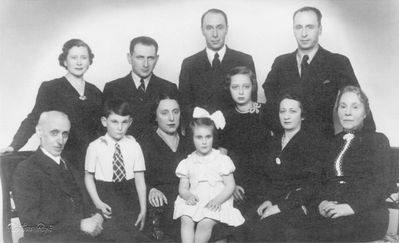 Schatz family - 1938/39 Riga
Left to right.
Sitting: Michel Schatz, Greta ? (Schatz) with children, Mara Pasternak (Schatz), Ljuba Schatz (Aisenstadt), Annette Schatz (Veinberg)
Standing: Lidia Schatz (?) wife of Aleksander, ? (Greta's husband), Aleksander Schatz, Isak Schatz
Michel, Annette, Aleksander and Lidia were killed in Riga gheto
