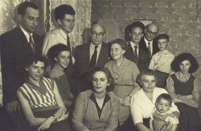 Rubanovitsch - 1957
Left to right.
Bottom row: Hani Zautin (Usvanski), Dina Gabovitsch (Dymschits), Miriam Usvanski (Gabovitsch) with Vadim Zautin
Second row: Zoja Gabovitsch (Skulski), Bluma Rubanovitsch (Gabovitsch), Karmela Usvanski
Top row: Anatoli Zautin, Jevgeni Gabovitsch, Jascha Rubanovitsch, Michael Rubanovitsch, Jacov Gabovitsch, Grigori Rubanovitsch
