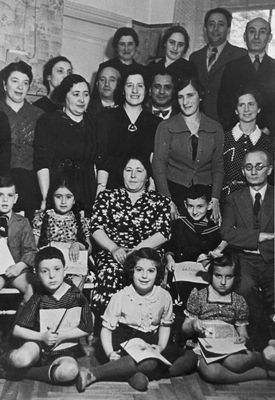 Rogovski family in 1939
Left to right.
At top: ?, ?, Elhanan Rogovski, Dr Bassel
II row: Sonja Rogovski, Hana Ring, Sonja Saks, Israel Dubovski (math teacher in Yidish), Selma Schur, ?, Dr Bassel, Manja Feigin
III row: Scharl Feigin, Lia Saks, Fanja Dubovski, Tolja Bassel, Efraim Rochlin
at bottom:  Haim Raichman, Lia Rogovski, Ruth Ring 
