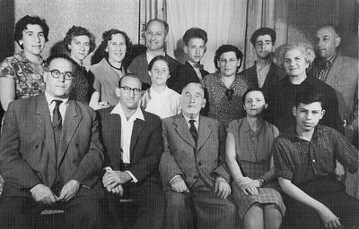 Schats. 1960 - Wulf (Vulja) Schats (from Israel) visit to Estonia 
Left to right
Bottom row: Moissei Schats, Wulf (Zeev) Schats, Don Schats, Mira Schats (Rochlin), Natan Levenschus
The girl in center: Elena Elkind (Kon)
Top row: Sara Levenschus (Schats), Stella Schulklepper, Freide Kon (Schats), Gersch Kon, Boris Kon, Basja Katchev (Schats), Leonid Schats, Musja Schats (Glükman), David Schats  
