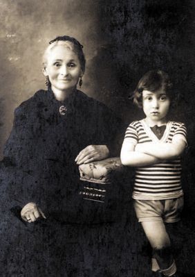 Haya-Sore Zivjan
This photograph shows Rachel Randvee paternal grandmother, Haya-Sore
Tsivian, and her grandson, Yakov Israelson. It was taken in the
summer of 1916, which Yakov spent at his grandmother's in
Riga.
Grandma Haya-Sore was pretty even in her old age, and she
was an unapproachable beauty in her youth. She told us how
long it had taken her to choose a husband and her father had
been very annoyed by this. Every one of grandma's sisters had
families of their own at the age of 14 or 15, but she did not
marry until she was 18.
