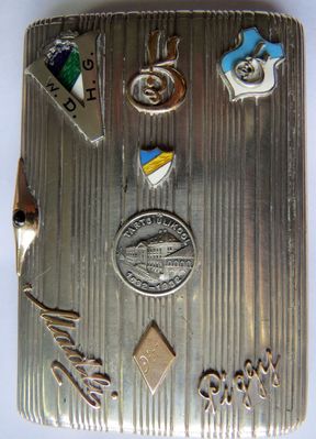 The cigarette case presented to A. Gini (Ginizisky) at the day of his departure to Palestine (3.12.1935). Tartu. 
In the middle - the sign of 300 years to Tartu University. Above it - Hasmonea coat of arms.
