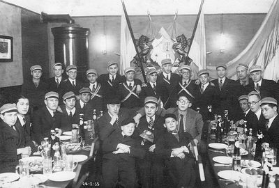 1935-1-26
"Bochurierung von Rips, Lazar, Beilinson u. Philistierung von Abram, Hirschkowitsch u. Gilinov"
Left to right.
Sitting at left: Max Boruhov, David Bakscht, Leva Beilinson, ?, ? 
Sitting at right: Kalman Gelbart, Willy Usvansky, ?
In the middle: Pessah Wasserman, David Feimann, Menasche Schein, Lelja Palin (from Riga), ? 
Standing: ?, Sasha Ginizisky, ?, ?, ?, ?, ?, Kalmanson, ?, ?, ?, Zvi Kamenovsky, Samuil Levitin
