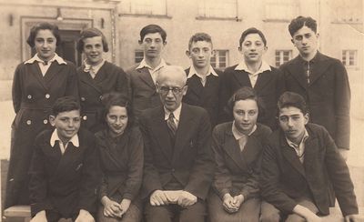 Tallinn - 1937. Jewish School. May 1937
Left to right.
Sitting: Harry Rybka, Roche Lea Naimark, Samuel Gurin, Lidia Morein (Ivanovski), ?
Standing: Lia Freidin (Rubanovitsch), Resi Vseviov (Vald), ?, Leib Braschinski, Hirsch Gleser, Pesach Freidin
Readable names on back:   Itzhak Danziger,  
